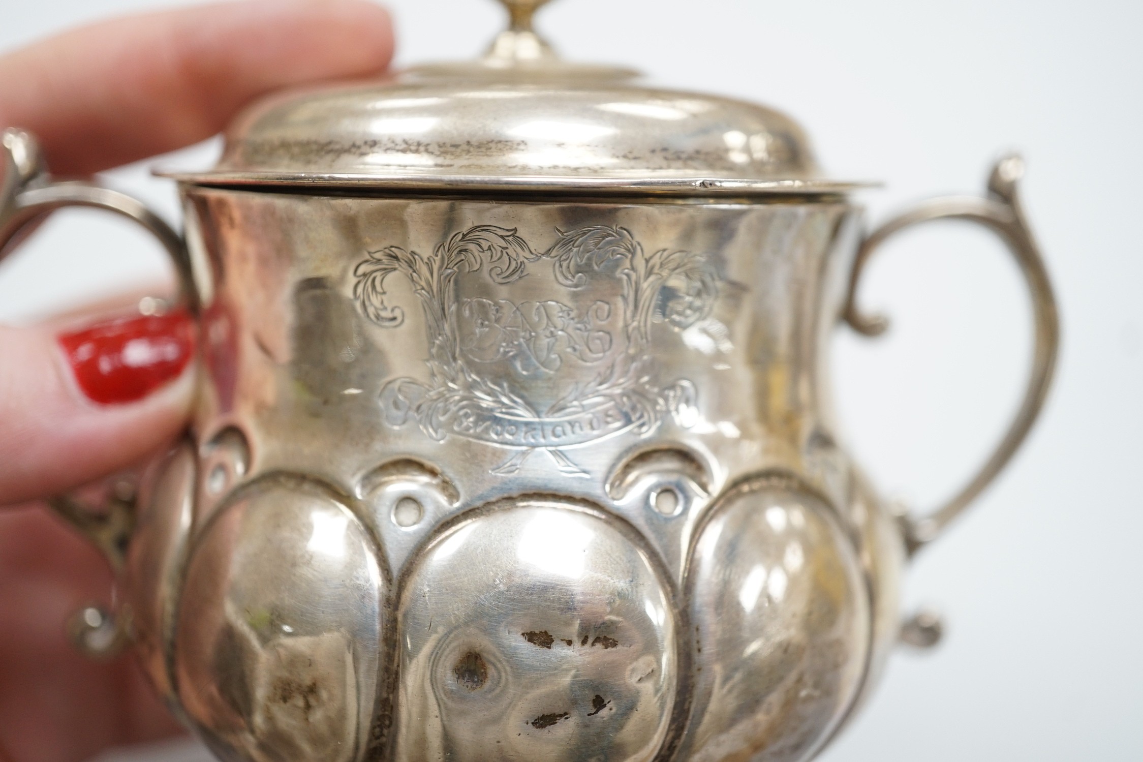 A George V silver presentation porringer and cover for the 'Rudge Motorcycle Sprint Race at Brooklands 13th of June 1912, third prize' William Comyns, height 10.5cm, 6.1oz.